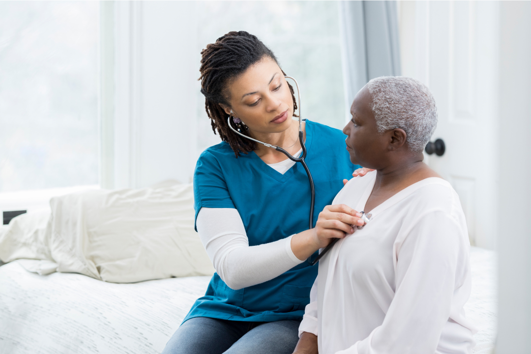 nurse-listening-heartbeat-elderly-patient-home-care